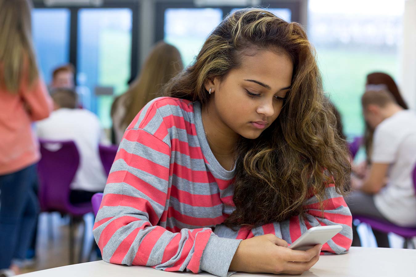 Photo of young person using an app
